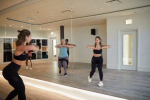 Group of women exercising at a Pvolve fitness franchise studio