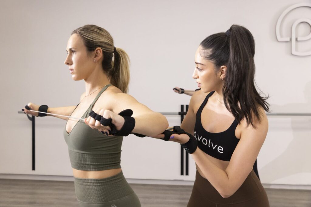 Pvolve NYC Fitness Class - Women Using a Resistance Band