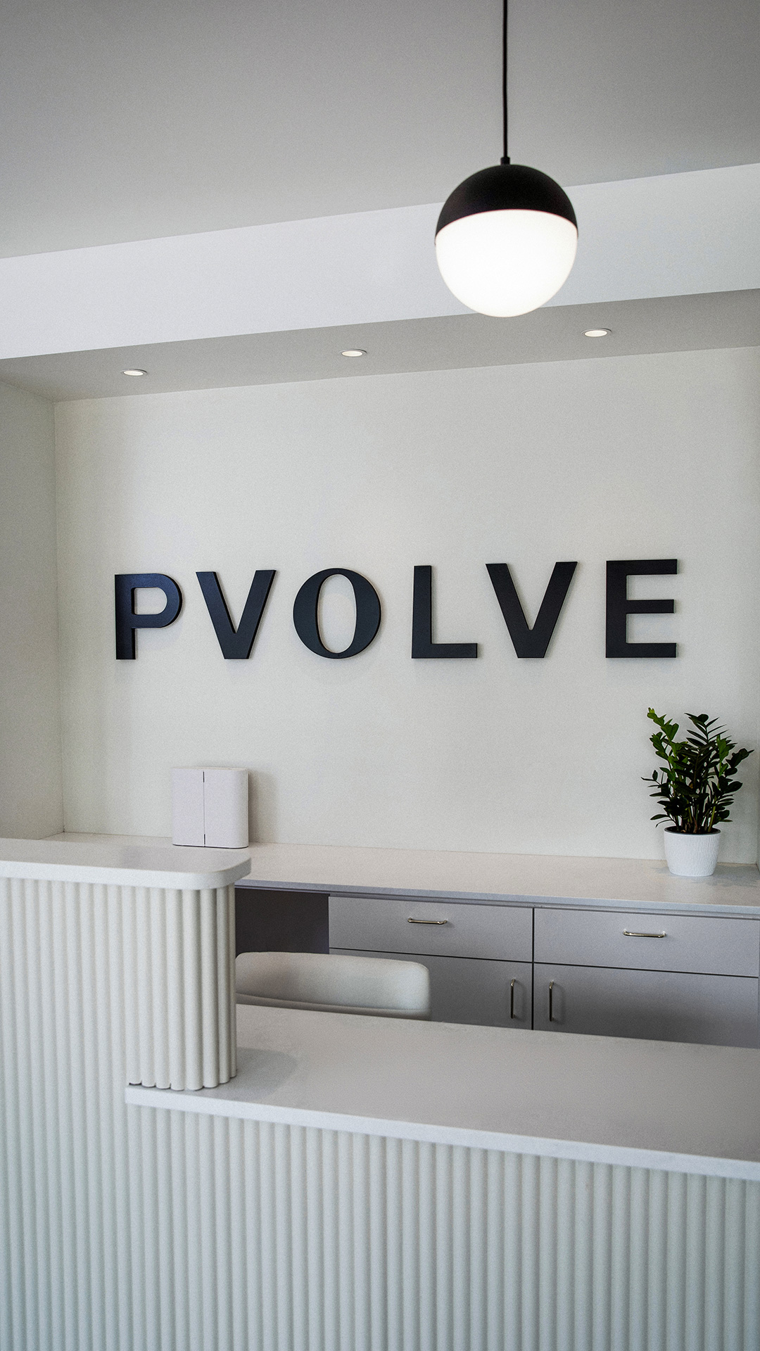Pvolve Front Desk with logo