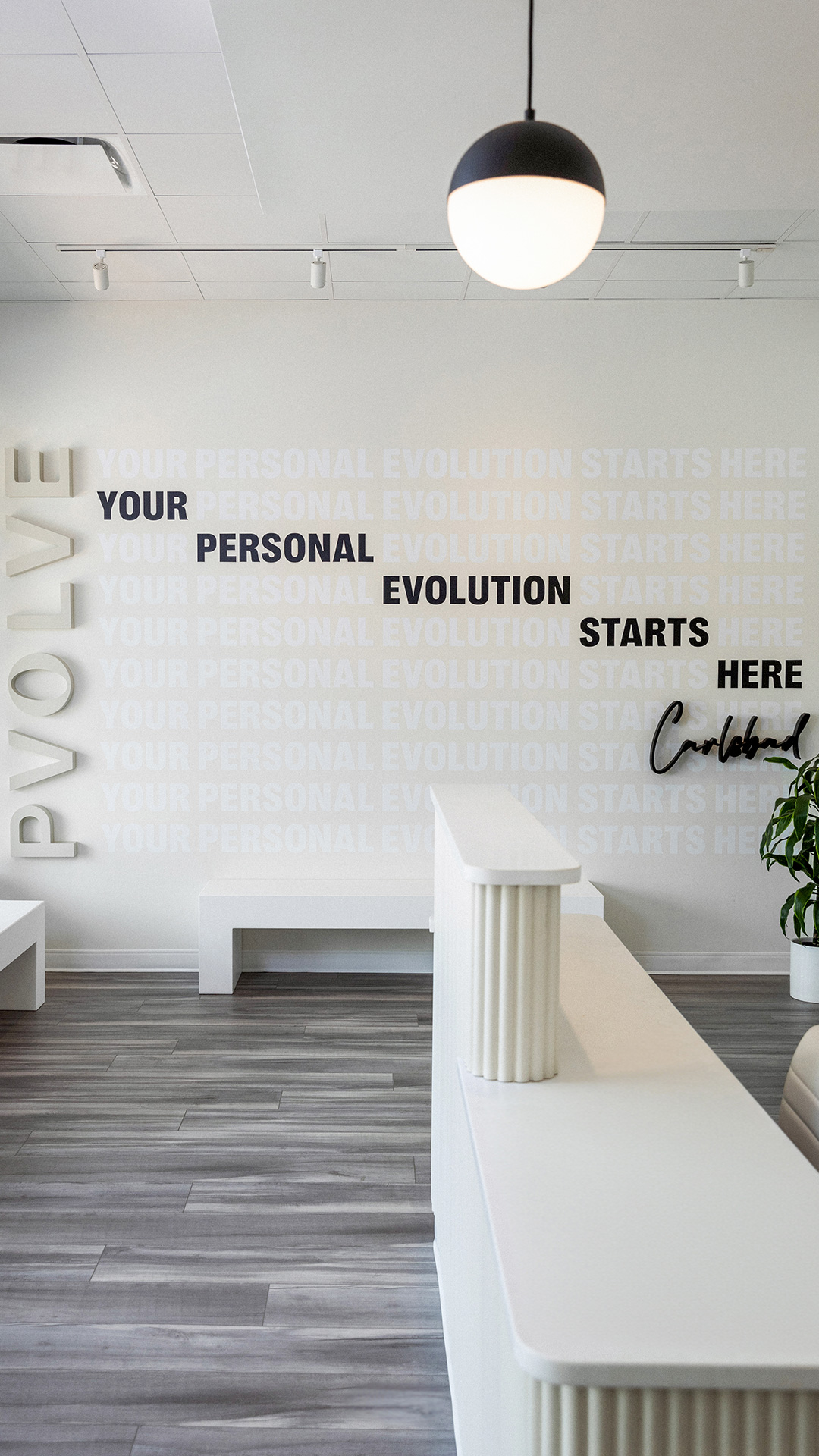 Pvolve front desk with wall art